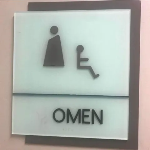 The Missing W on the Women’s Sign