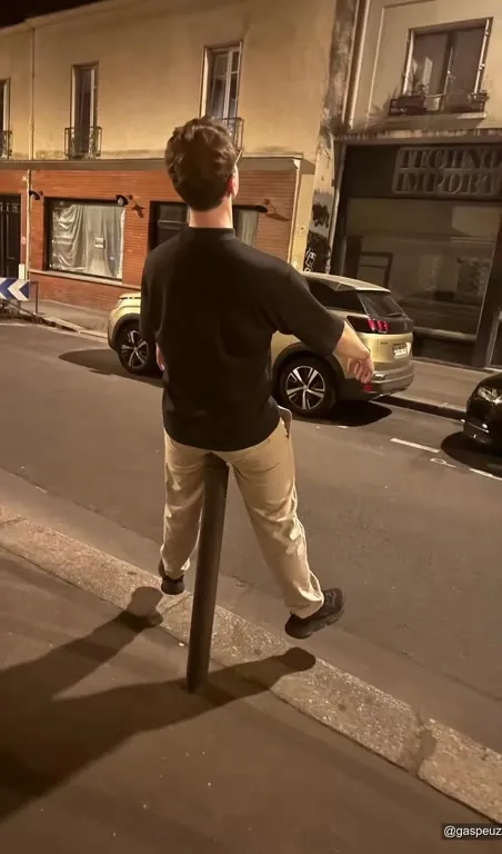 Man Leaning on Bollards