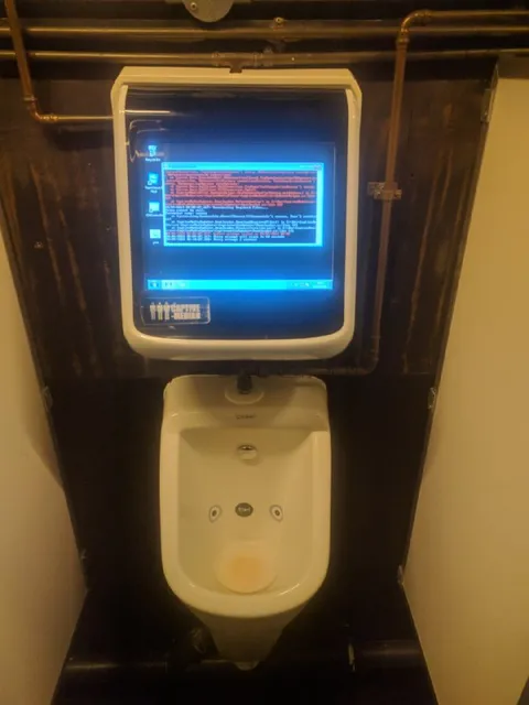 Computer Above a Urinal