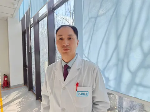 Dr. Jiankui He in a Lab Coat