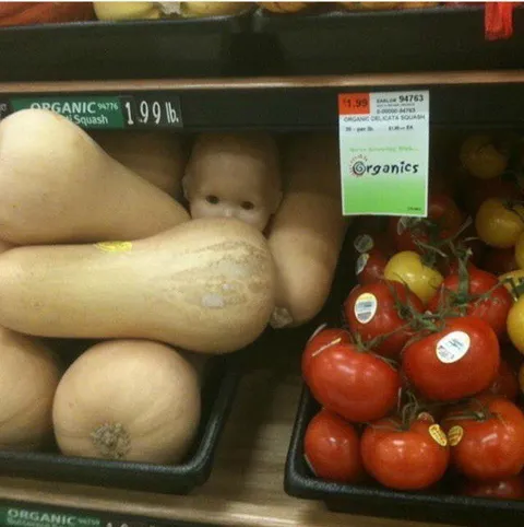 Baby Hiding Among the Squash