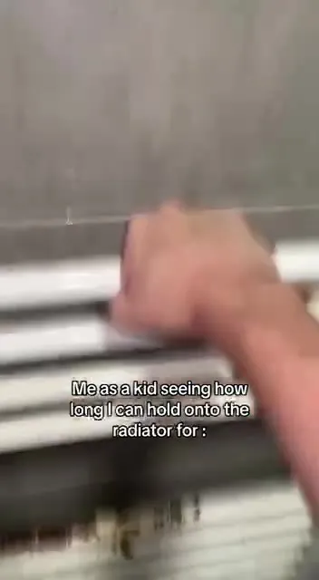 Kid Holding Onto the Radiator