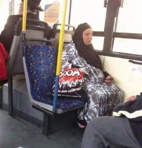 Woman Wrapped in a Blanket on Bus