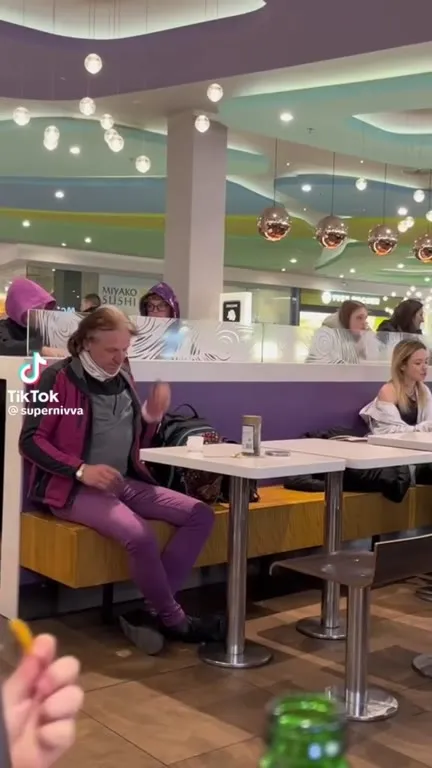 Purple Man Vibing at Dinner