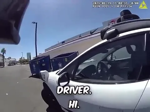 Officer Inspects the Driverless Car