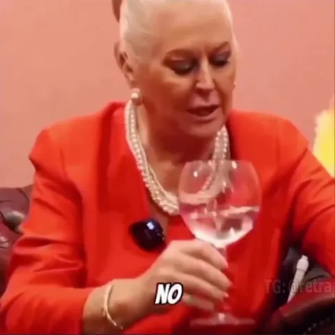 Woman Adds Ice to Her Drink