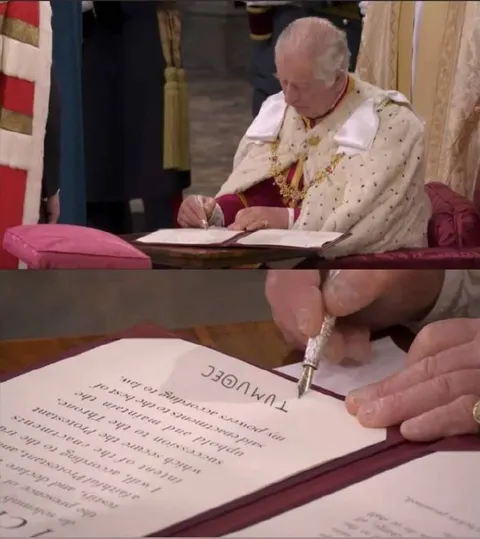King Charles Signs Upside Down