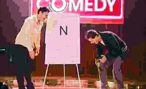 Two Men Bowing on Comedy Stage