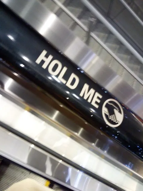 Hold Me Escalator Sign