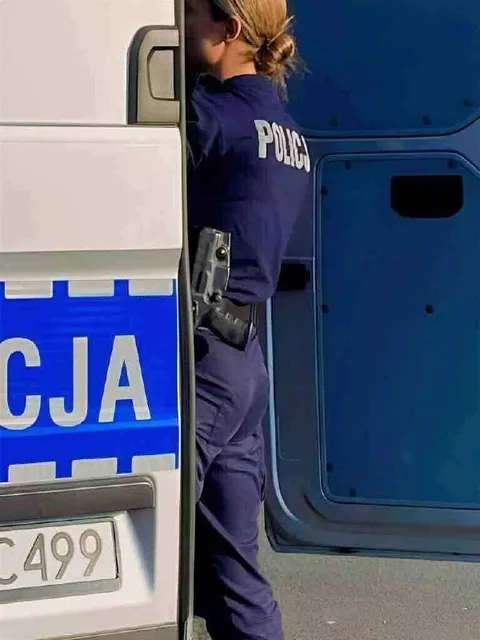 Police Officer Hiding Behind Truck