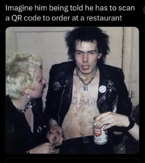 Sid Vicious Scans a QR Code