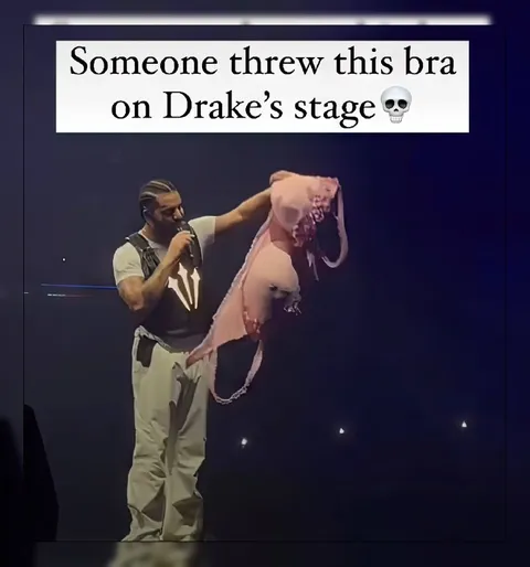 Drake Holds a Bra on Stage