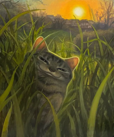Кот прячется в траве