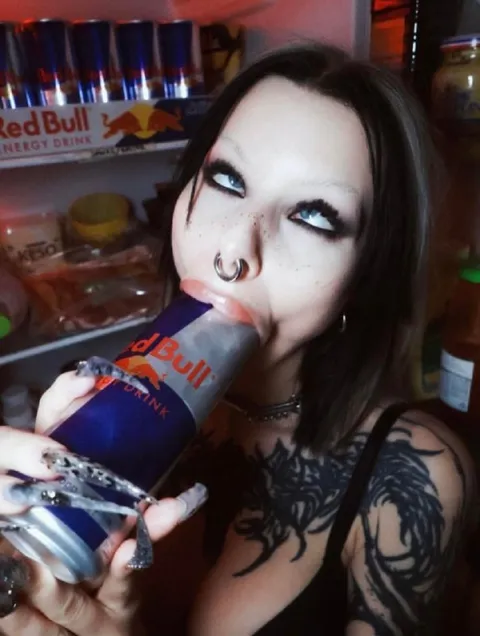 Woman Drinks Red Bull Seductively