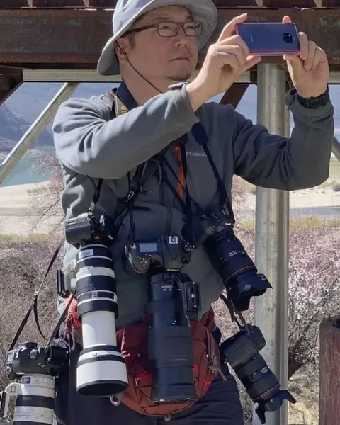 Фотограф со всем арсеналом