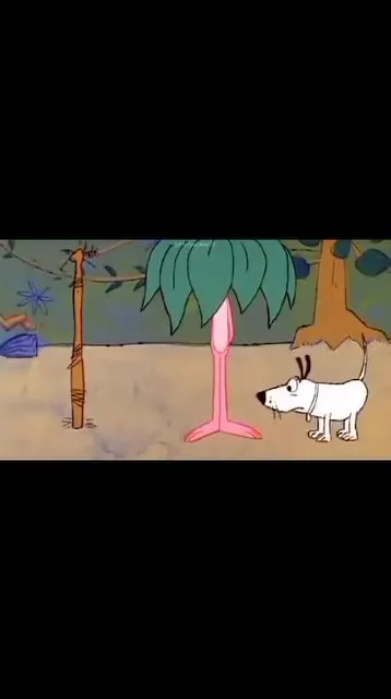 Пёс нюхает странный цветок
