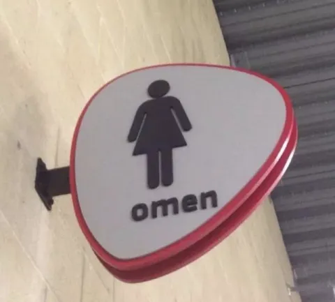 Omen Women's Restroom Sign