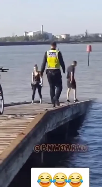 Police Officer Takes a Swim