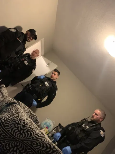 Police Surround the Bed