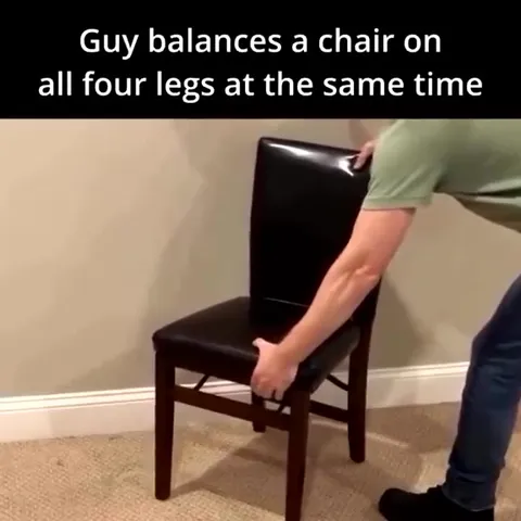 Guy Balances Chair on Four Legs