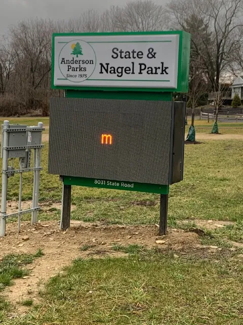 Park Sign With Glowing M