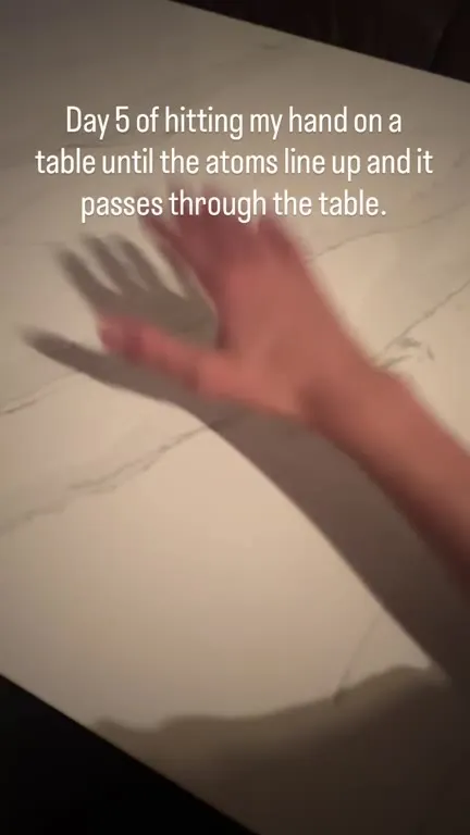 Atoms Line Up Hand Through Table