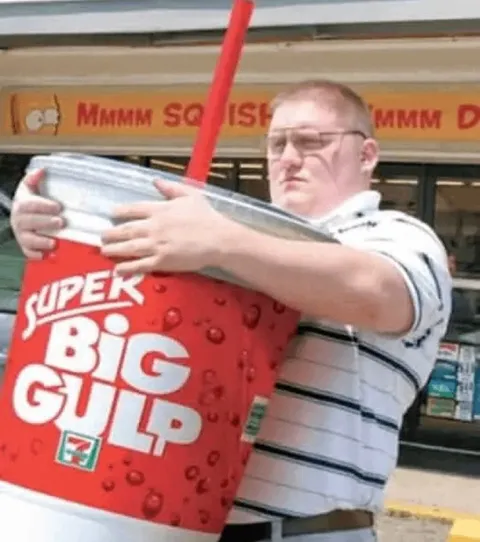 Man Hugging Giant Big Gulp