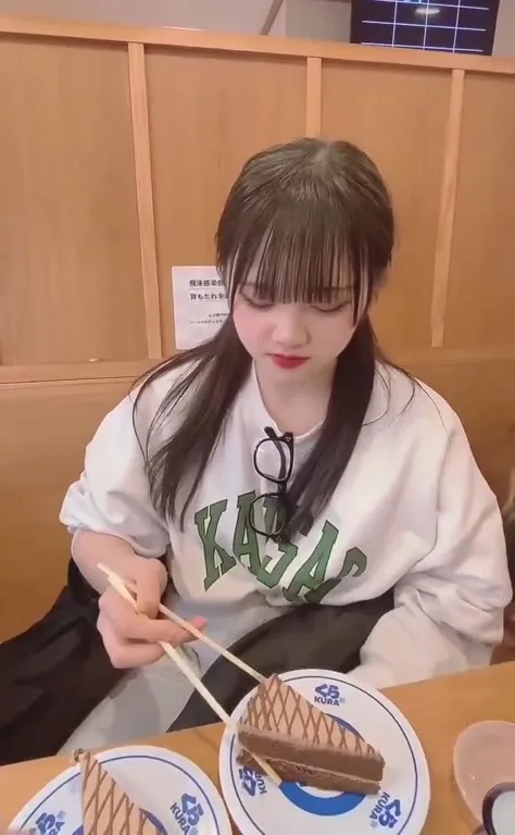 Girl Devours Cake With Chopsticks
