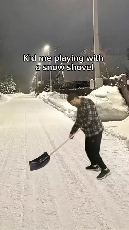 Kid Playing With Snow Shovel