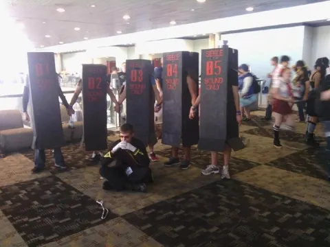 People Hiding Inside Sound Boxes