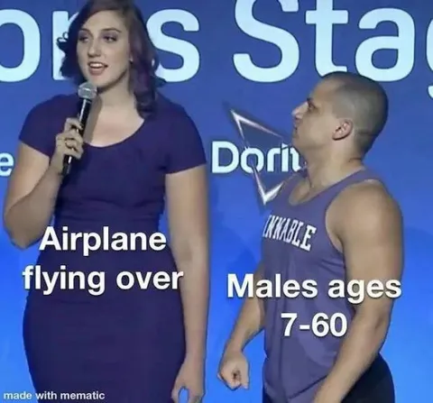 Airplane Flying Over Males
