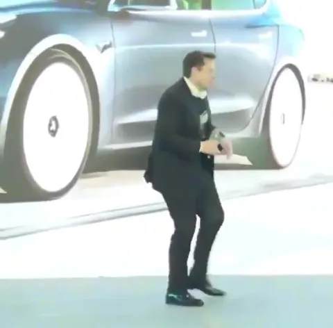 Elon Musk Dancing by the Car