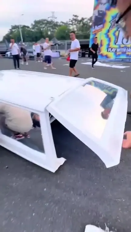 People Hiding Under a Fake Car
