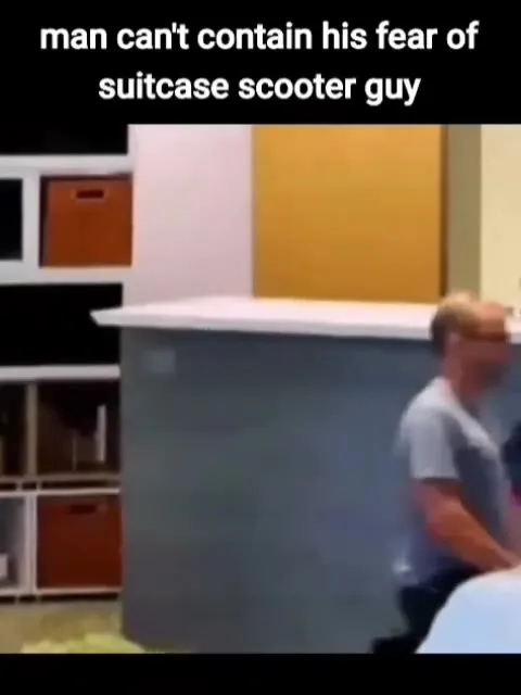 Man Fears Suitcase Scooter Guy