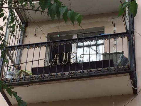 Balcony With Ornate Initials