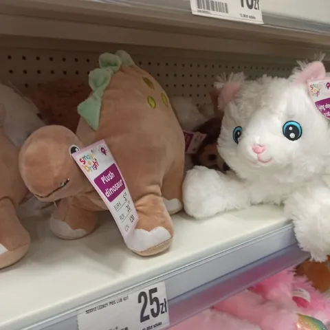 Plush Dinosaur and Wide-Eyed Cat