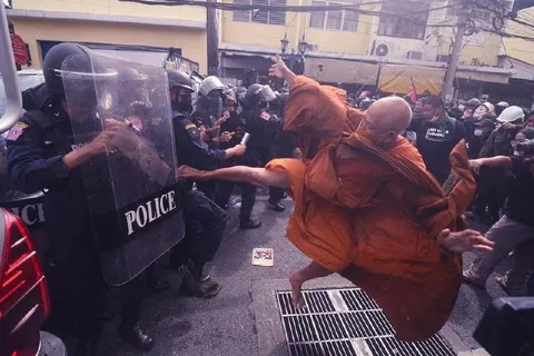 Monk Kicks Police Shield