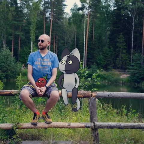 Man Sitting Beside Cartoon Characters