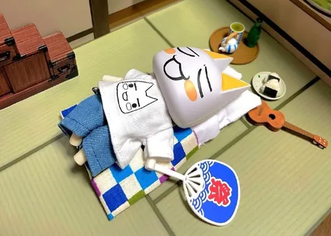 祭りで寝落ちする猫