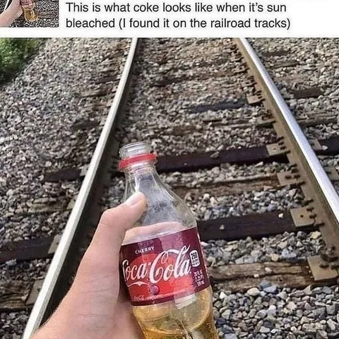 Sun-Bleached Coke on Railroad Tracks
