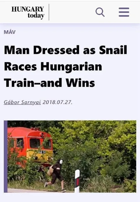 Man Dressed as Snail Races Train