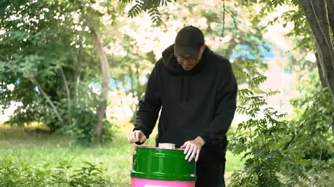 Man playing a barrel drum