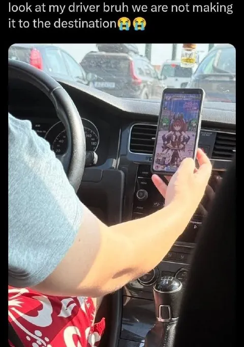 Driver Playing Games in Traffic