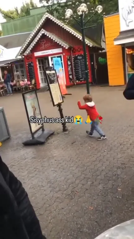 Sisyphus Kid Pushes Sign