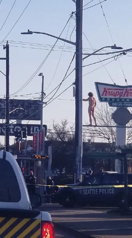 Naked Man on Krispy Kreme Sign