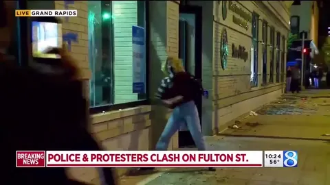 Protester Smashes the Window