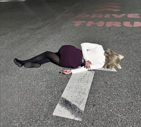 Woman Lying in Drive-Thru