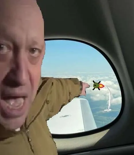 Человек высовывается из самолёта