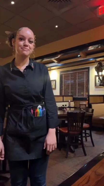 Waitress Offers a Food Box