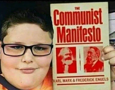 Child Holding The Communist Manifesto